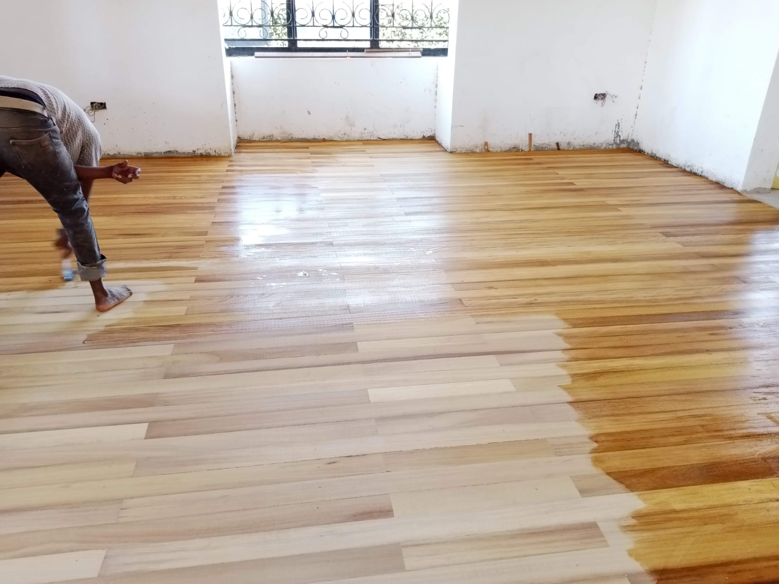 Long Strips Mvule Floor Fixing, Sanding & Varnishing